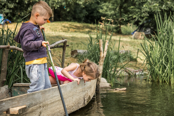 Little boy girl fishing boat